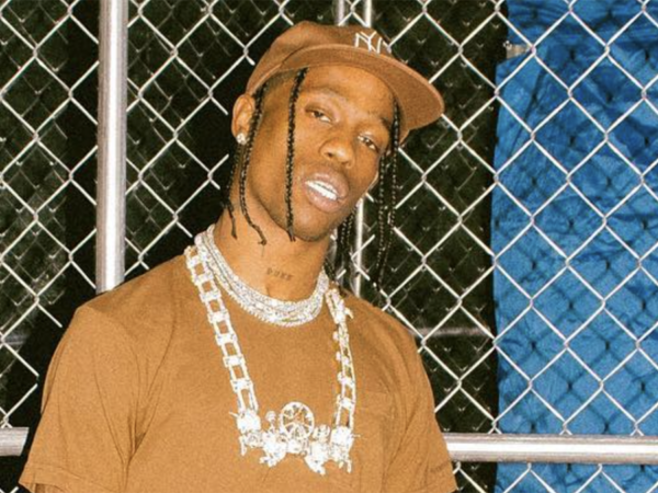 TRAVIS SCOTT FACES LEGAL ACTION FOR TOSSING FAN’S PHONE
